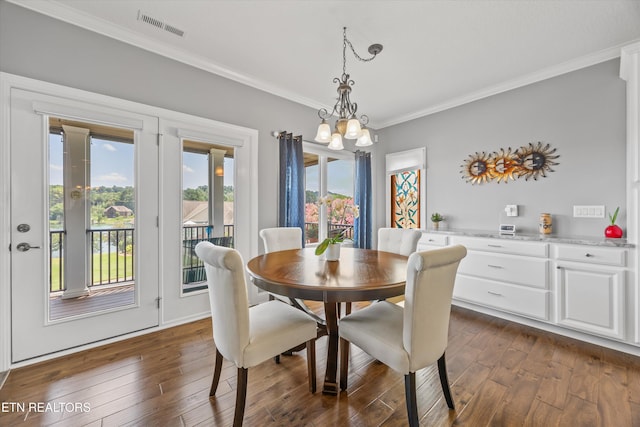 404 Chota Landing Way, Loudon, TN 37774 - dining room with crown molding, dark wood-style flooring, and a chandelier