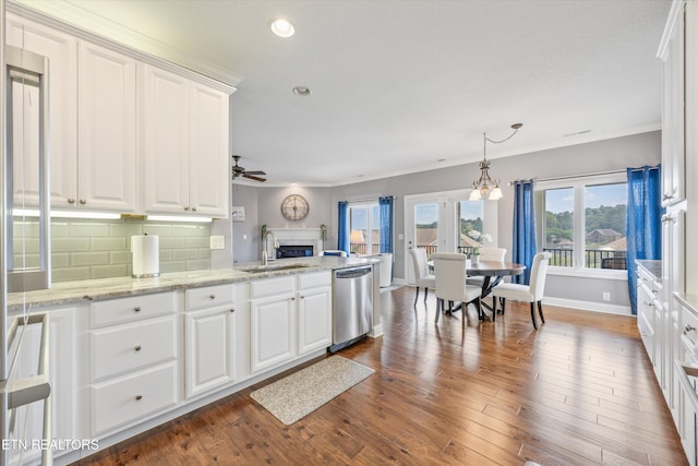 404 Chota Landing Way, Loudon, TN 37774 - kitchen with dishwasher, white cabinetry, a ceiling fan, a fireplace, and recessed lighting