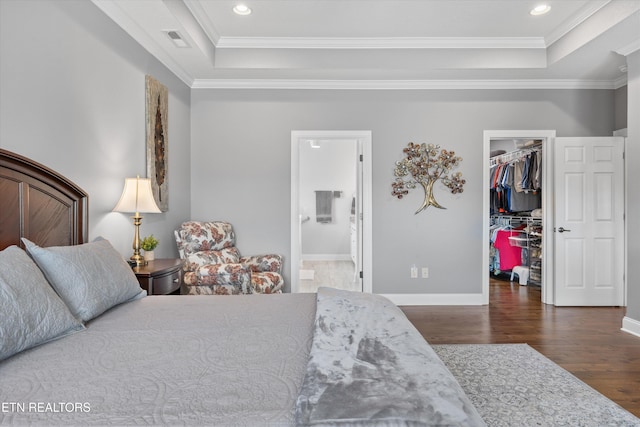 404 Chota Landing Way, Loudon, TN 37774 - bedroom with a tray ceiling, a walk in closet, wood finished floors, crown molding, and recessed lighting