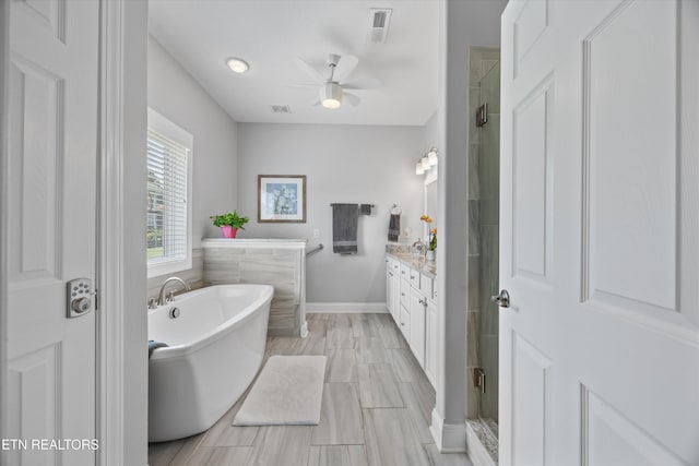 404 Chota Landing Way, Loudon, TN 37774 - bathroom with vanity, a stall shower, ceiling fan, and a freestanding tub