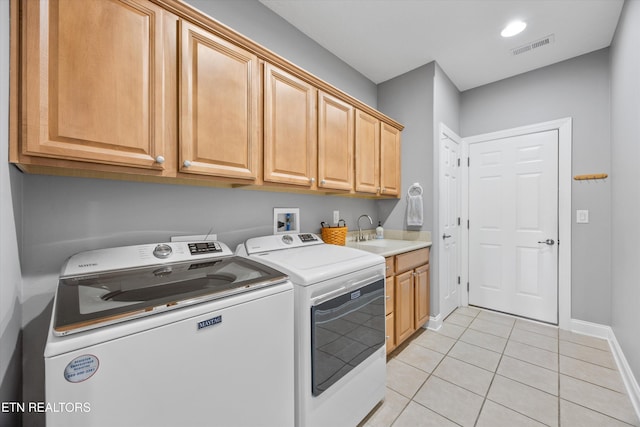 404 Chota Landing Way, Loudon, TN 37774 - laundry area with cabinet space, light tile patterned flooring, and washer and clothes dryer