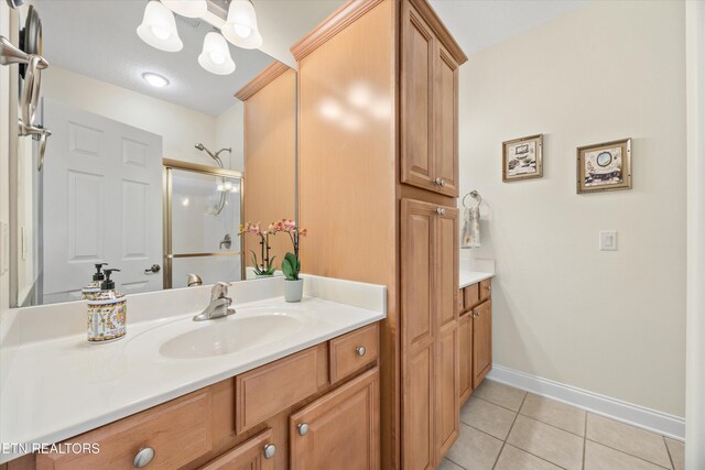 404 Chota Landing Way, Loudon, TN 37774 - full bath with vanity, tile patterned floors, a stall shower, and a chandelier
