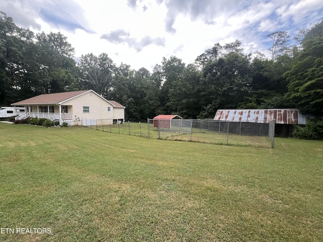 295 Clear Branch Rd, Corryton, TN 37721 - view of yard featuring an outbuilding and covered porch