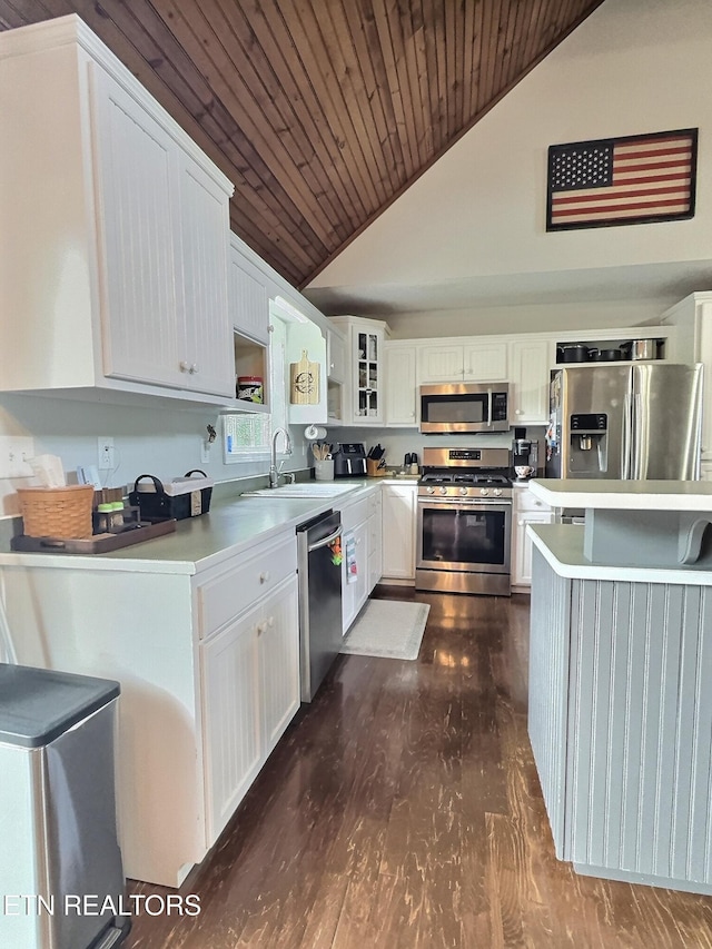 1292 Martin Ln, Lafollette, TN 37766 - kitchen with stainless steel appliances, vaulted ceiling, wood ceiling, dark wood finished floors, and white cabinetry