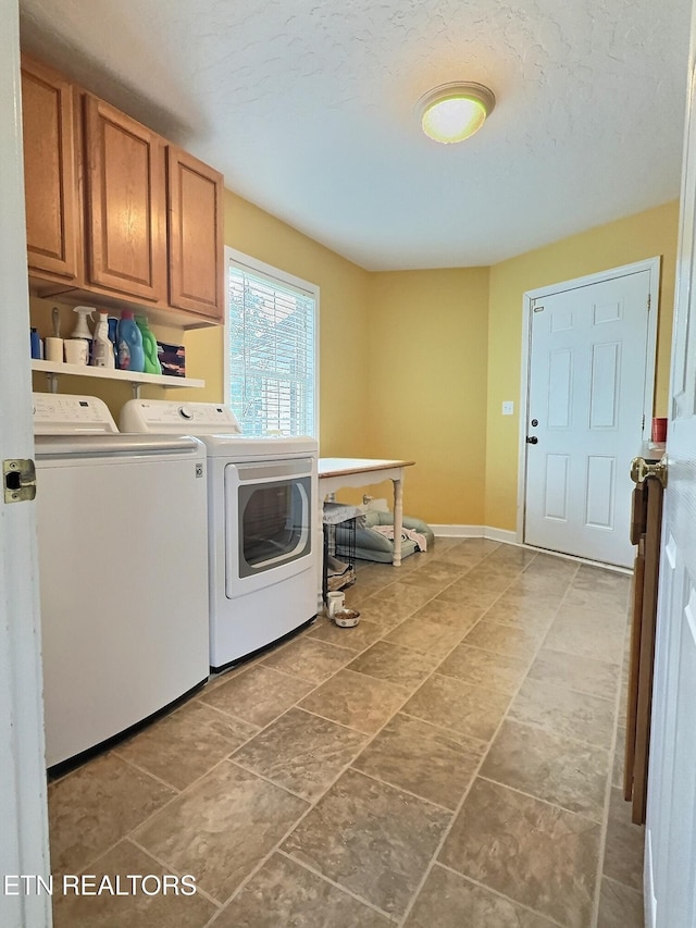 1292 Martin Ln, Lafollette, TN 37766 - laundry room with washing machine and clothes dryer, cabinet space, and a textured ceiling
