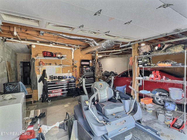 1292 Martin Ln, Lafollette, TN 37766 - garage featuring a workshop area