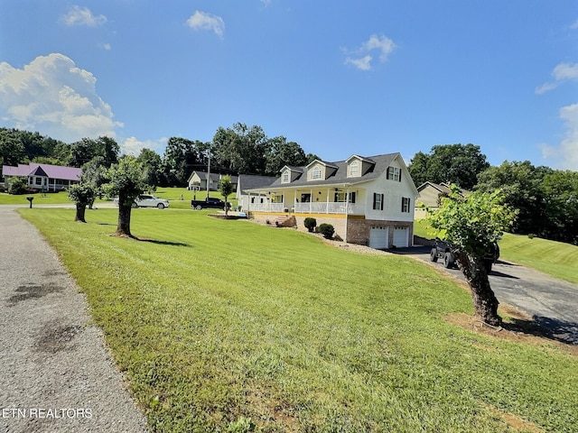 1292 Martin Ln, Lafollette, TN 37766 - cape cod home with a garage, a front lawn, asphalt driveway, and brick siding