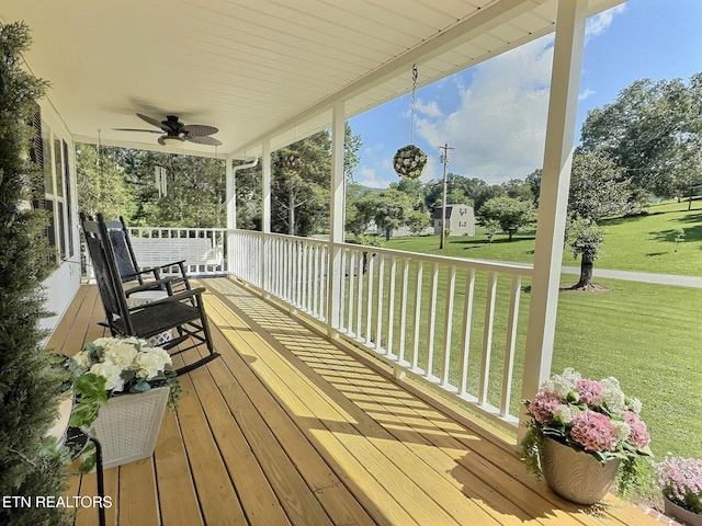 1292 Martin Ln, Lafollette, TN 37766 - wooden porch with a ceiling fan and a lawn