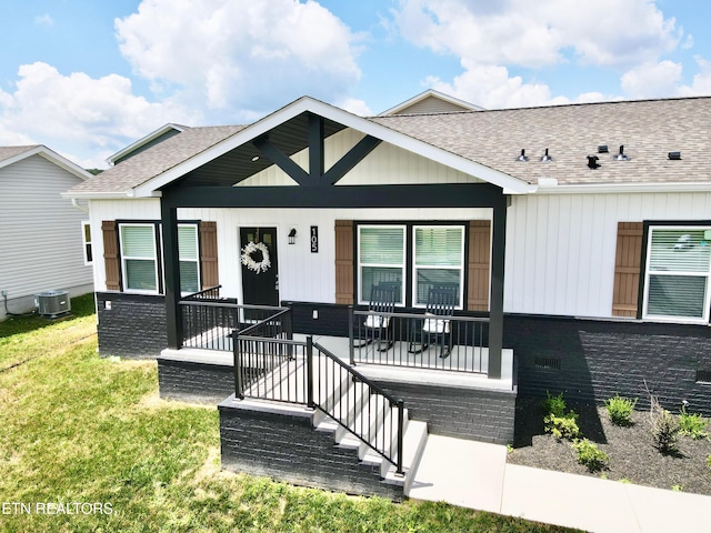 105 Ruby Ln, New Tazewell, TN 37824 - view of front of house with a shingled roof, covered porch, and a front lawn