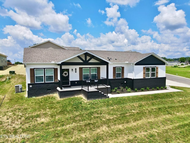 105 Ruby Ln, New Tazewell, TN 37824 - view of front of house with a front lawn, a shingled roof, covered porch, and brick siding