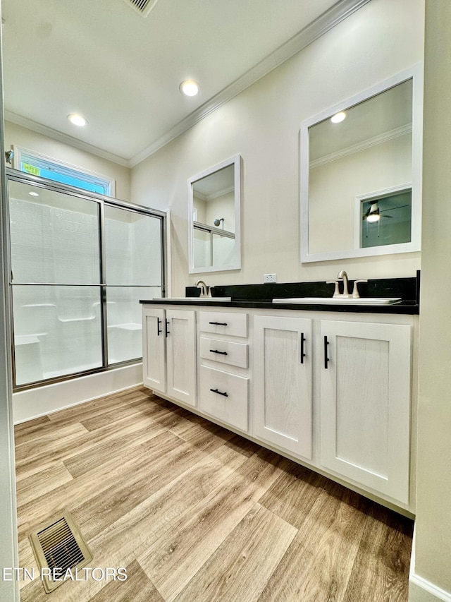 105 Ruby Ln, New Tazewell, TN 37824 - bathroom featuring crown molding, wood finished floors, double vanity, a shower with door, and recessed lighting