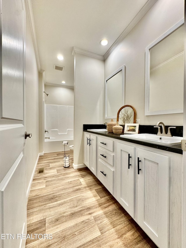 105 Ruby Ln, New Tazewell, TN 37824 - bathroom with ornamental molding, double vanity, wood finished floors, washtub / shower combination, and recessed lighting
