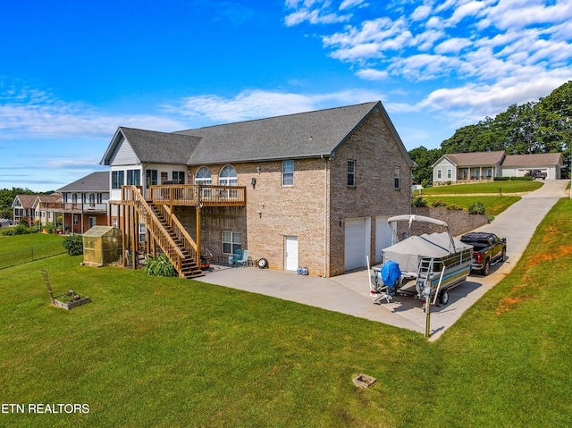 108 Skyline Dr, Dandridge, TN 37725 - rear view of property featuring an attached garage, concrete driveway, a wooden deck, a patio, and stairs