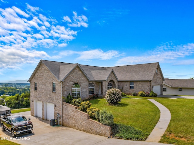 108 Skyline Dr, Dandridge, TN 37725 - view of front facade featuring a garage, brick siding, concrete driveway, and a front yard