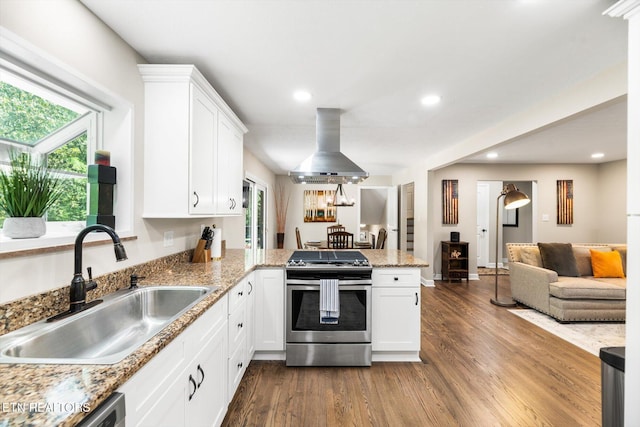 313 Hardwicke Dr, Knoxville, TN 37923 - kitchen with stainless steel range with gas cooktop, range hood, a peninsula, dark wood finished floors, and recessed lighting