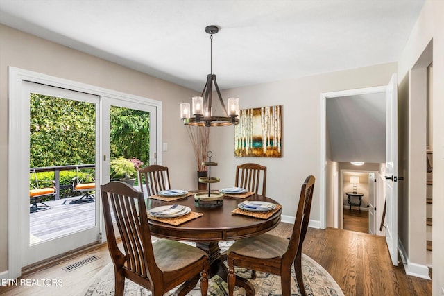 313 Hardwicke Dr, Knoxville, TN 37923 - dining area featuring a chandelier and wood finished floors