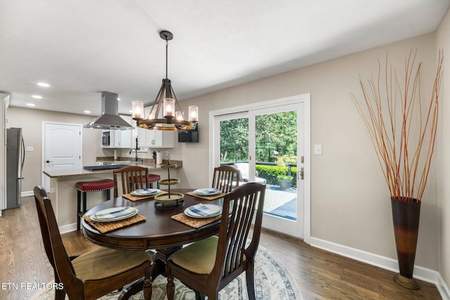 313 Hardwicke Dr, Knoxville, TN 37923 - dining area with a chandelier, wood finished floors, and recessed lighting