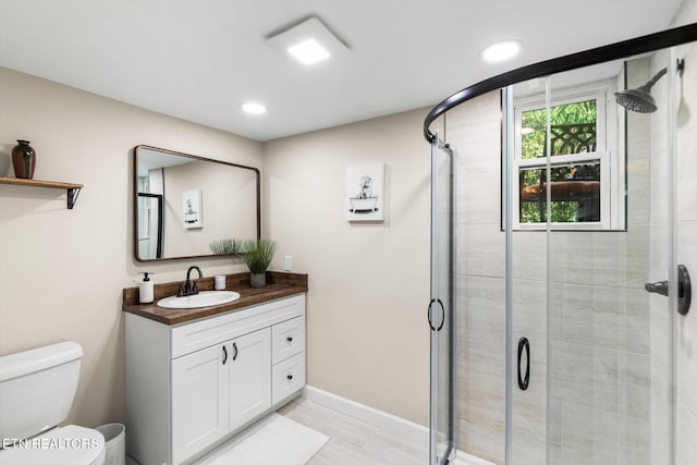 313 Hardwicke Dr, Knoxville, TN 37923 - full bathroom with vanity, a shower stall, recessed lighting, and wood finished floors