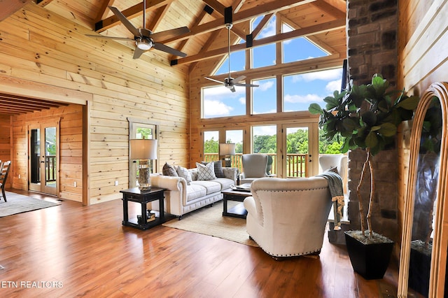 1144 Sanctuary Shores Way, Sevierville, TN 37876 - living room with high vaulted ceiling, wooden walls, healthy amount of natural light, a wooden ceiling with exposed beams, and a ceiling fan