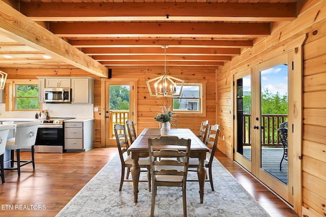 1144 Sanctuary Shores Way, Sevierville, TN 37876 - dining space featuring beamed ceiling, healthy amount of natural light, a chandelier, light wood finished floors, and french doors