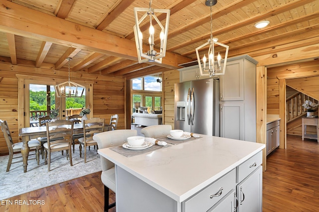 1144 Sanctuary Shores Way, Sevierville, TN 37876 - kitchen with a chandelier, stainless steel refrigerator with ice dispenser, wooden walls, healthy amount of natural light, and dark wood-style flooring