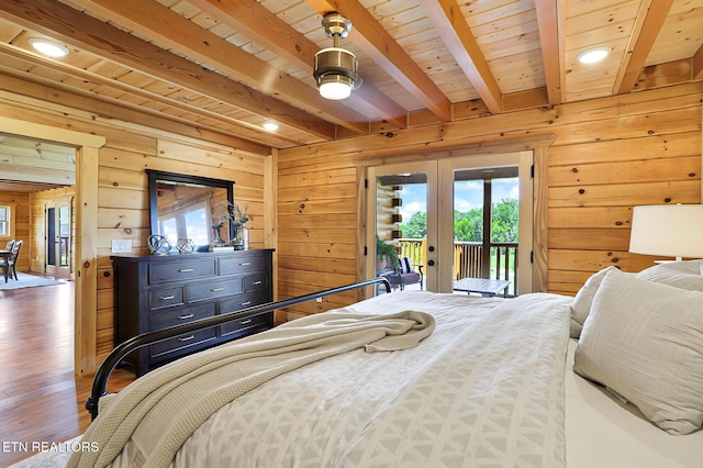 1144 Sanctuary Shores Way, Sevierville, TN 37876 - bedroom with french doors, wooden walls, beam ceiling, access to exterior, and wood finished floors