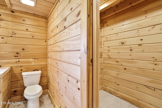 1144 Sanctuary Shores Way, Sevierville, TN 37876 - bathroom with wood walls, marble look tile flooring, wood ceiling, and vanity