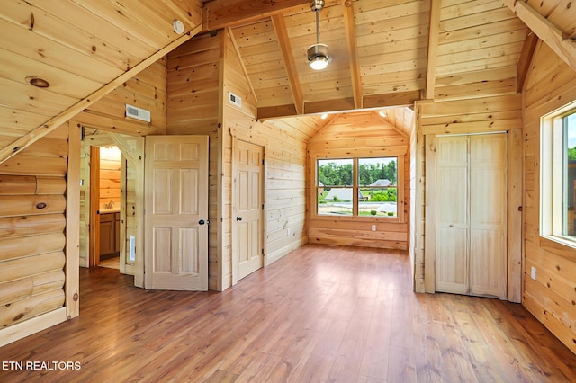 1144 Sanctuary Shores Way, Sevierville, TN 37876 - unfurnished bedroom with a wood ceiling with exposed beams, wood walls, multiple windows, wood-type flooring, and high vaulted ceiling
