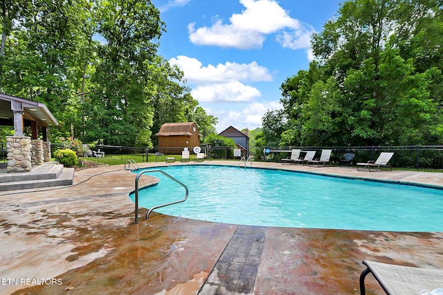 1144 Sanctuary Shores Way, Sevierville, TN 37876 - community pool with a patio area and view of scattered trees