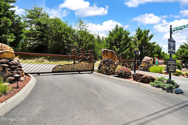 1144 Sanctuary Shores Way, Sevierville, TN 37876 - view of asphalt street with curbs and a gated entry