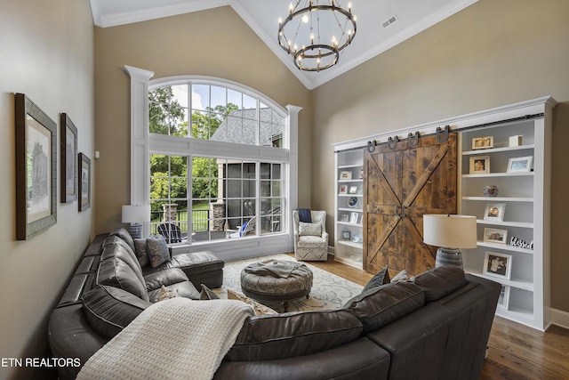 12706 Highwick Cir, Knoxville, TN 37934 - living room with a chandelier, high vaulted ceiling, dark wood finished floors, and crown molding