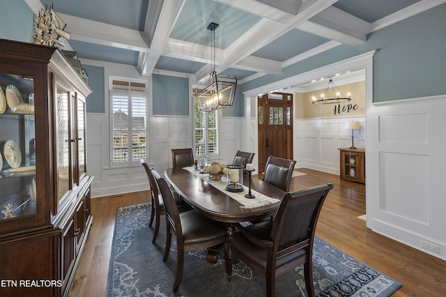 12706 Highwick Cir, Knoxville, TN 37934 - dining space with a chandelier, a decorative wall, a wainscoted wall, beam ceiling, and wood finished floors