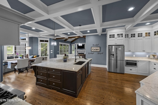 12706 Highwick Cir, Knoxville, TN 37934 - kitchen featuring appliances with stainless steel finishes, white cabinets, open floor plan, coffered ceiling, and beam ceiling