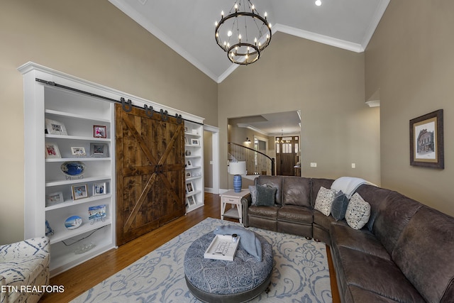 12706 Highwick Cir, Knoxville, TN 37934 - living room featuring crown molding, a chandelier, wood finished floors, a barn door, and high vaulted ceiling