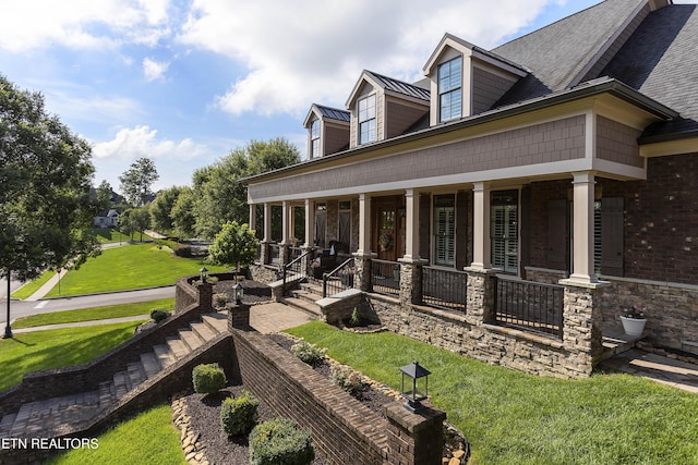 12706 Highwick Cir, Knoxville, TN 37934 - view of side of home featuring covered porch, a yard, and a standing seam roof