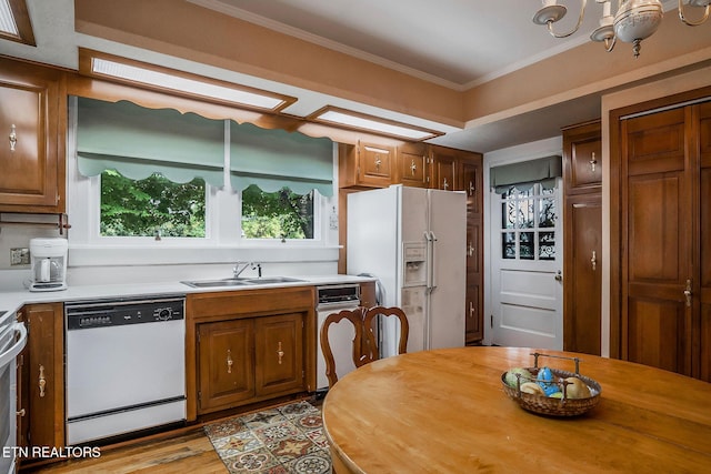 105 N Church St, Sparta, TN 38583 - kitchen with white appliances, ornamental molding, brown cabinetry, wood finished floors, and wooden counters