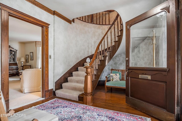 105 N Church St, Sparta, TN 38583 - entrance foyer with wood finished floors, stairway, wallpapered walls, and crown molding