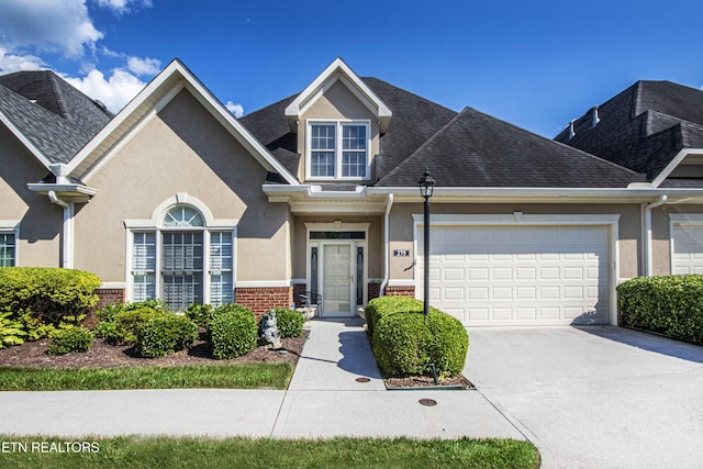 275 Fordham Way, Knoxville, TN 37934 - view of front facade featuring concrete driveway, a garage, stucco siding, brick siding, and a shingled roof