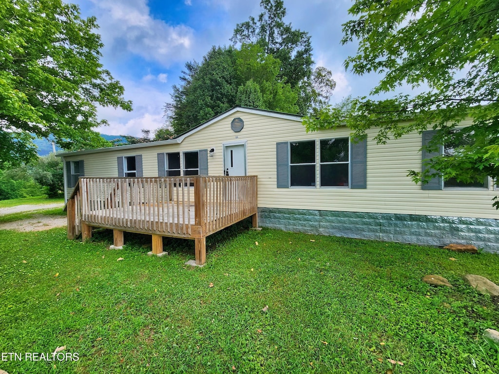 106 Delap Ln, Lafollette, TN 37766 - back of house with a deck and a yard