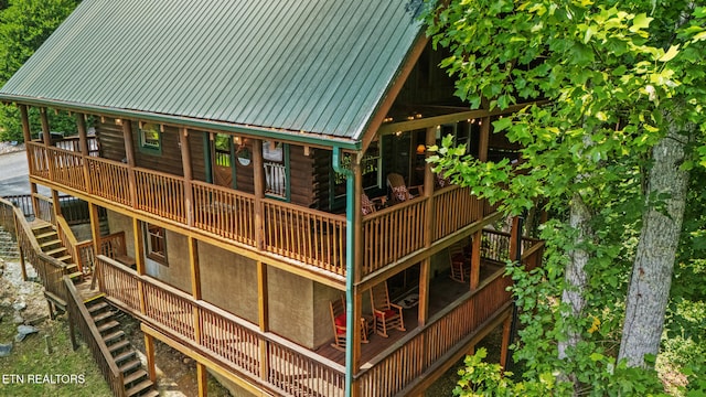 4410 Forest Vista Way, Pigeon Forge, TN 37863 - rear view of house with stairway, a deck, log siding, and a metal roof