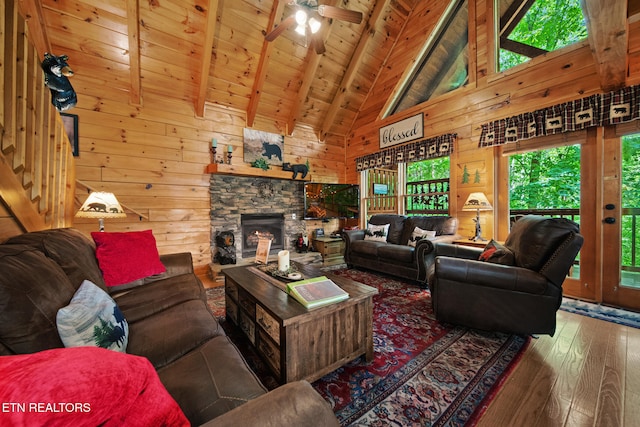 4410 Forest Vista Way, Pigeon Forge, TN 37863 - living room featuring hardwood / wood-style flooring, wood walls, ceiling fan, high vaulted ceiling, and a wooden ceiling with exposed beams