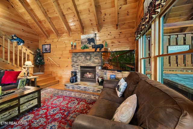 4410 Forest Vista Way, Pigeon Forge, TN 37863 - living area with wood ceiling, wooden walls, a stone fireplace, and wood finished floors