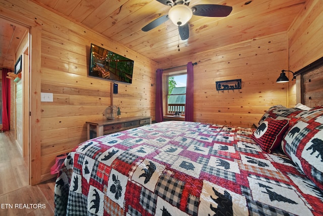 4410 Forest Vista Way, Pigeon Forge, TN 37863 - bedroom with wood finished floors, wooden walls, wooden ceiling, and ceiling fan
