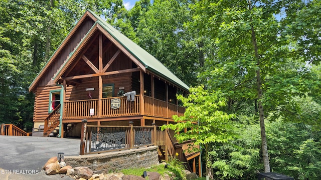 4410 Forest Vista Way, Pigeon Forge, TN 37863 - view of front of property featuring stairs, log exterior, and a porch