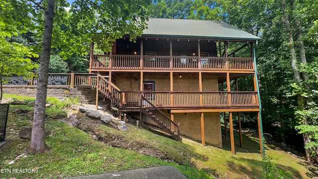 4410 Forest Vista Way, Pigeon Forge, TN 37863 - back of property with stairway, a wooden deck, and a metal roof