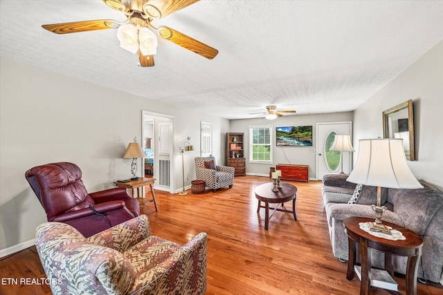 454 Boyd St, Celina, TN 38551 - living area featuring ceiling fan, light wood finished floors, and a textured ceiling
