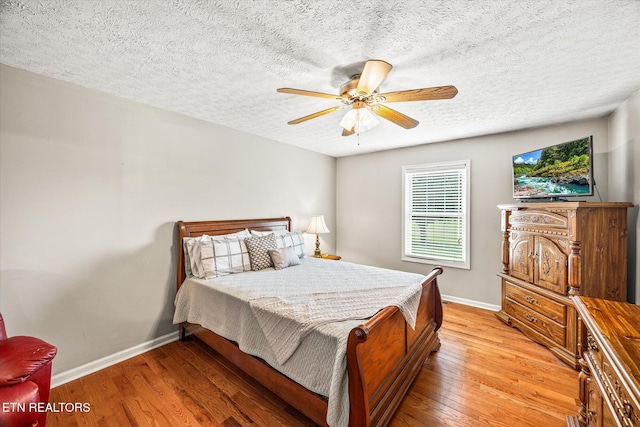 454 Boyd St, Celina, TN 38551 - bedroom with light wood-type flooring, a textured ceiling, and a ceiling fan