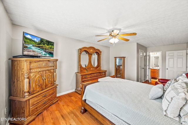 454 Boyd St, Celina, TN 38551 - bedroom with light wood-style floors, connected bathroom, a textured ceiling, and ceiling fan