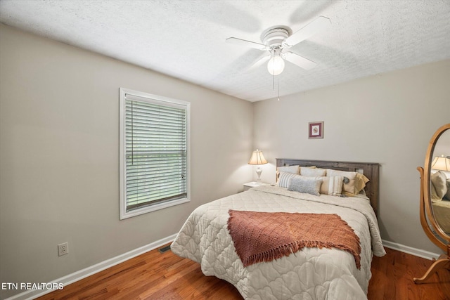 454 Boyd St, Celina, TN 38551 - bedroom with wood finished floors, a textured ceiling, and ceiling fan