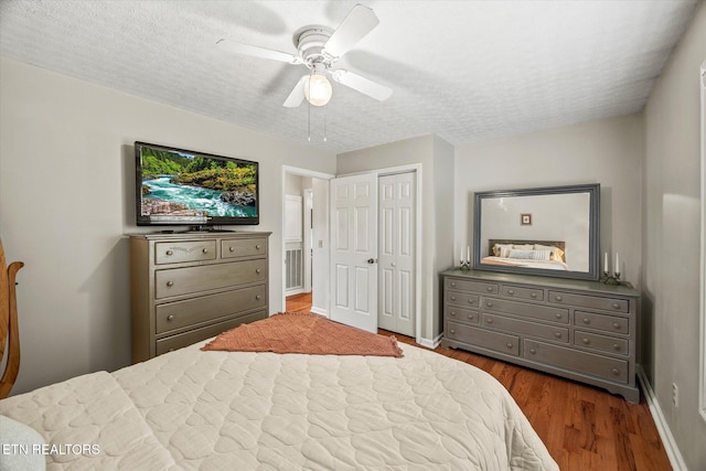 454 Boyd St, Celina, TN 38551 - bedroom with a closet, dark wood-style flooring, a textured ceiling, and ceiling fan